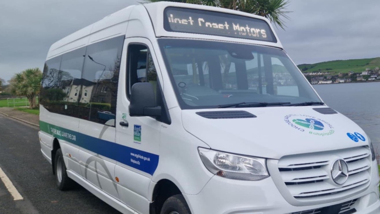 White bus by road side